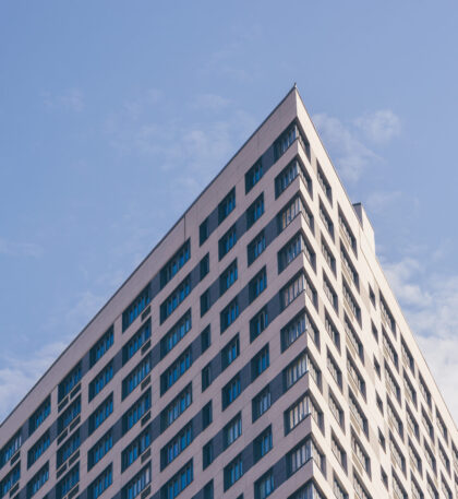 Angle of the Skyscraper on the Sky Background. Angle of the Skyscraper on the Cloudy Sky Background. Toned.